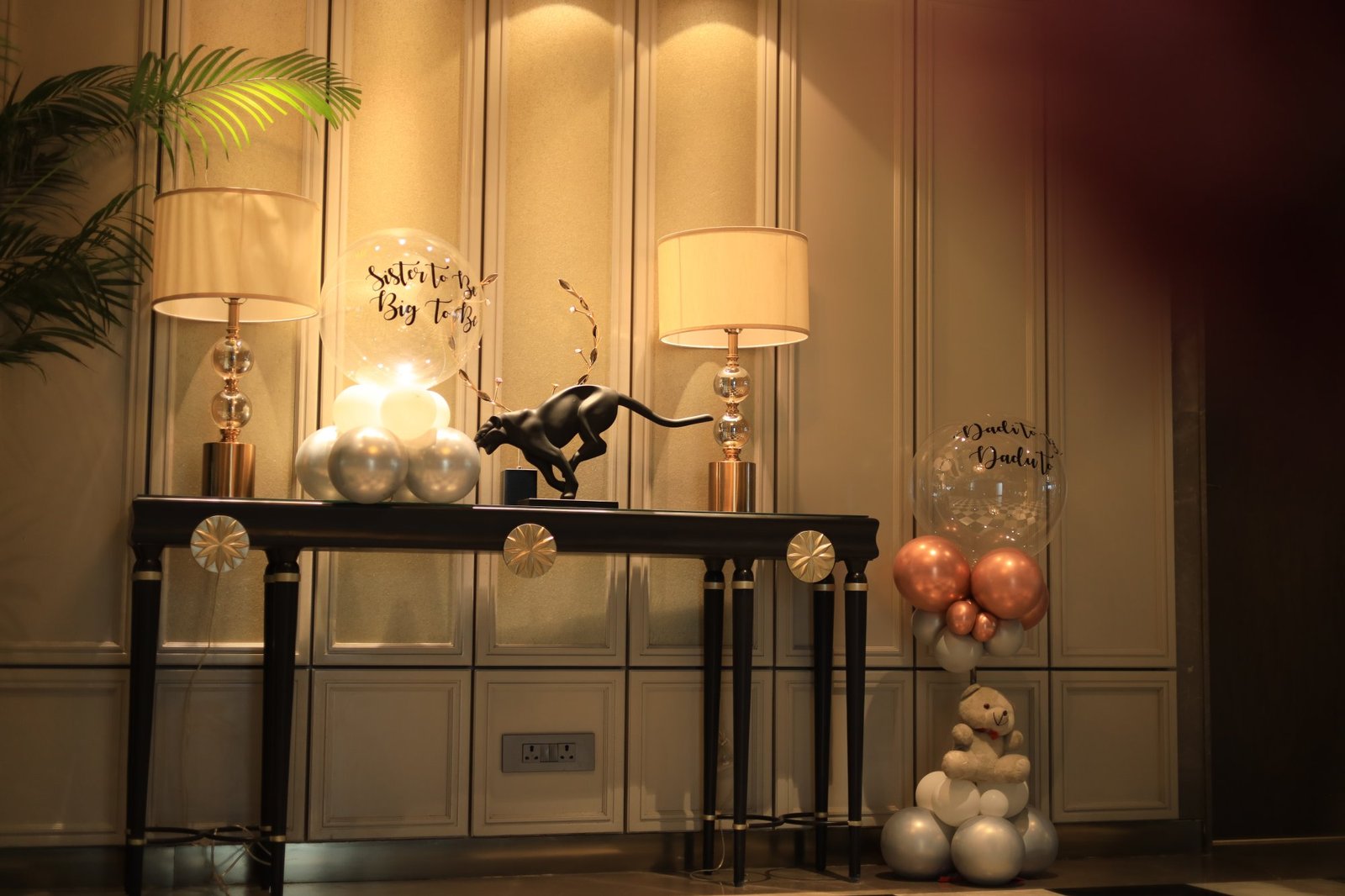 Styled console table with balloons and decor before guests arrive