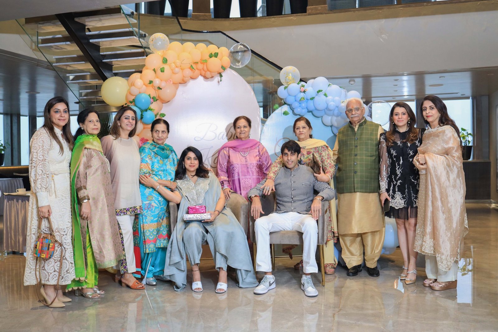 Extended family gathered together at the baby shower