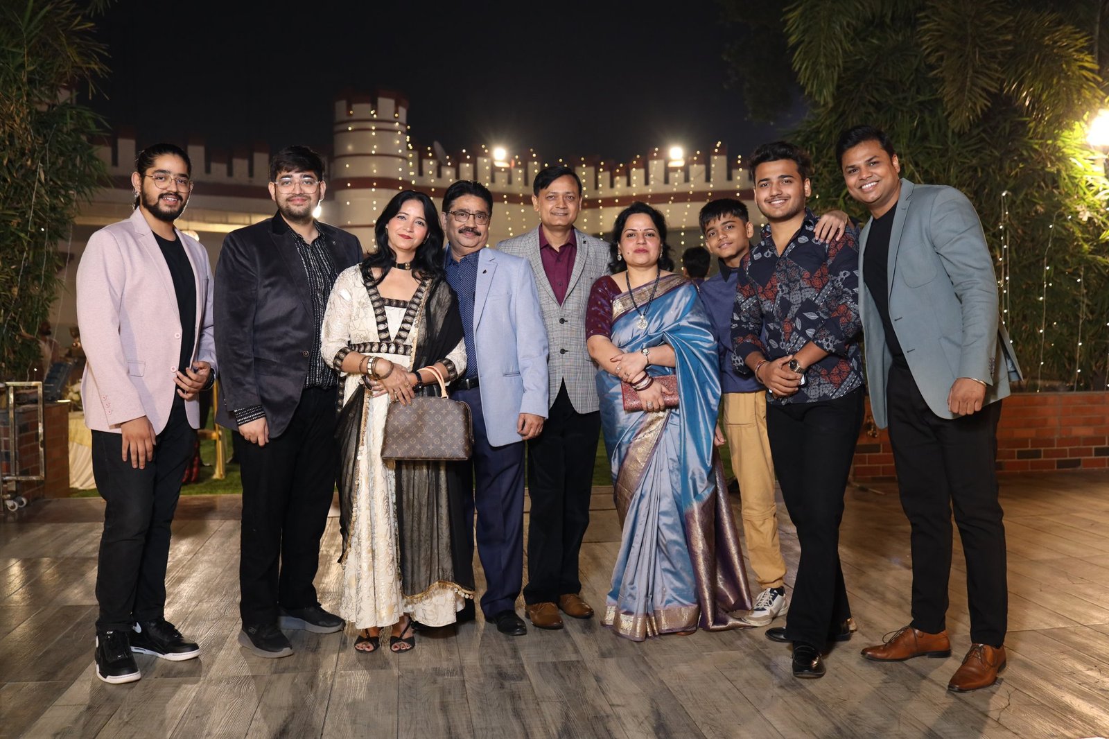 Extended family group photographed together at the celebration