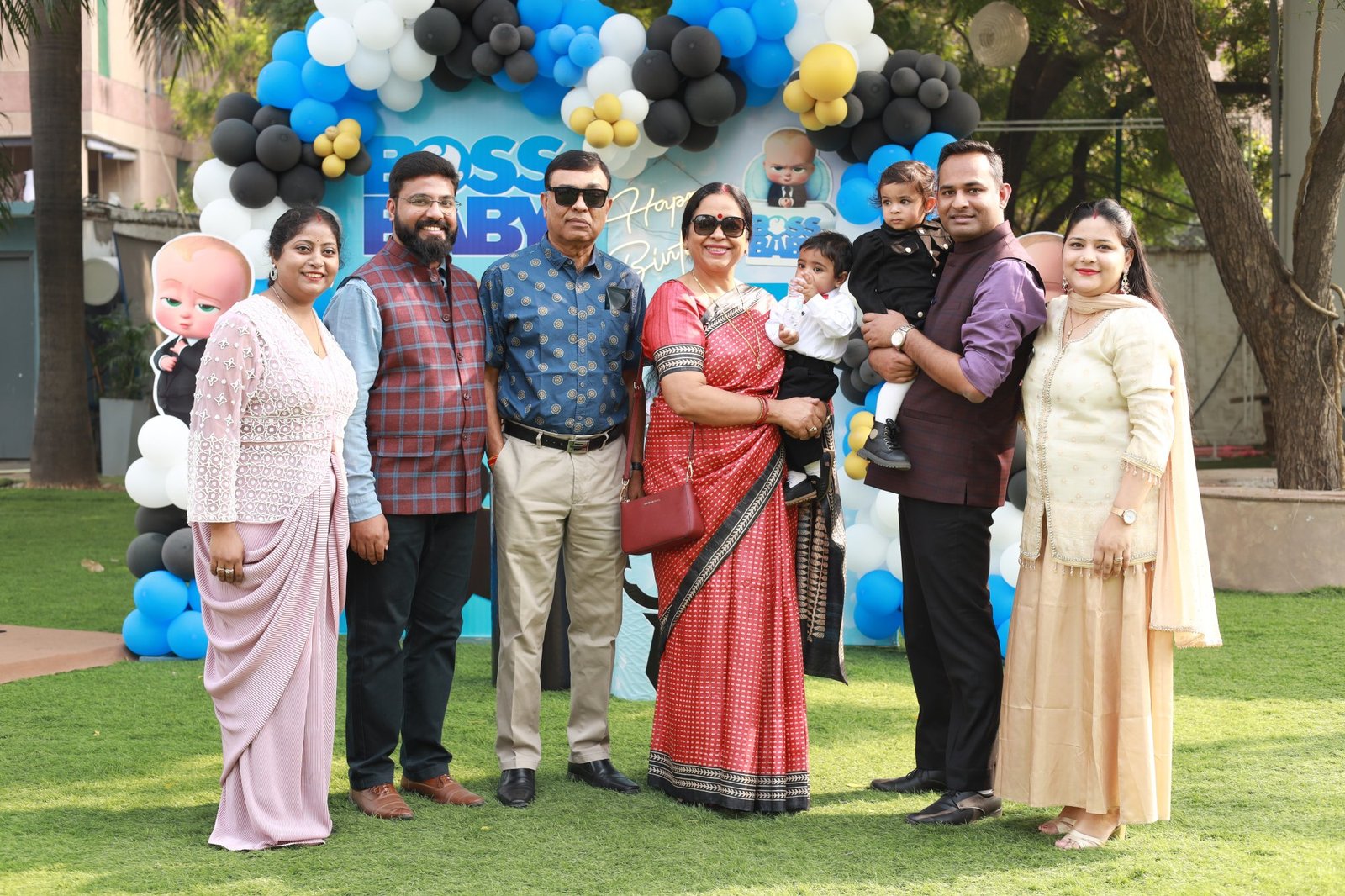 Guests gathered in the garden during a daytime birthday party